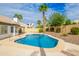 Beautiful backyard featuring a sparkling pool, desert landscaping, and a view of the rear of the home at 4214 E Morrow Dr, Phoenix, AZ 85050