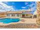 Private backyard pool offers a serene retreat with lush landscaping and an inviting home exterior at 4214 E Morrow Dr, Phoenix, AZ 85050