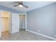 Bedroom with modern ceiling fan, neutral walls, and wood-look tile floor at 4214 E Morrow Dr, Phoenix, AZ 85050