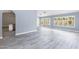 Bright living room with wood-look tile floors and abundant natural light from large windows at 4214 E Morrow Dr, Phoenix, AZ 85050