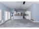 Open floor plan with gray floors seamlessly connecting the living area with the kitchen at 4214 E Morrow Dr, Phoenix, AZ 85050