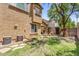 Large backyard features grass, AC units, stepping stones and a playset in the distance at 4355 E Cullumber St, Gilbert, AZ 85234