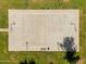 Overhead aerial shot of a well-kept outdoor basketball court featuring clear markings, surrounded by lush green space, for community recreation at 4355 E Cullumber St, Gilbert, AZ 85234