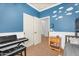 Bedroom features a bunk bed and blue accent wall with cloud decals at 4355 E Cullumber St, Gilbert, AZ 85234