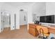 Bright home office area with a built-in desk and view to an adjacent room at 4355 E Cullumber St, Gilbert, AZ 85234