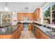 Well-equipped kitchen with stainless steel appliances, granite countertops, and ample cabinet space at 4355 E Cullumber St, Gilbert, AZ 85234