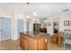 Bright kitchen features a center island with granite countertops and pendant lighting at 4355 E Cullumber St, Gilbert, AZ 85234