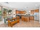 Spacious kitchen and dining area with a center island, stainless steel appliances, and tile flooring at 4355 E Cullumber St, Gilbert, AZ 85234