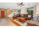 Bright living room with hardwood flooring, staircase, and ample seating at 4355 E Cullumber St, Gilbert, AZ 85234