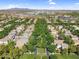 Aerial view of a residential street lined with lush trees and well-maintained homes, highlighting a peaceful neighborhood setting at 4355 E Cullumber St, Gilbert, AZ 85234
