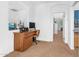 Upstairs office with a wooden desk, comfortable chair, and nearby hallway at 4355 E Cullumber St, Gilbert, AZ 85234