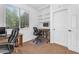 Home office with built-in shelving, desk, and comfortable seating at 4355 E Cullumber St, Gilbert, AZ 85234
