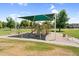 Community playground with a shaded structure, slide, and other play equipment for enjoyment at 4355 E Cullumber St, Gilbert, AZ 85234