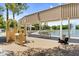 Covered playground area with various play structures and picnic tables, ideal for Gathering outings at 4355 E Cullumber St, Gilbert, AZ 85234