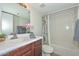 Cozy bathroom features a shower and tub combo, wood cabinets, and modern fixtures at 4730 W Northern Ave # 1141, Glendale, AZ 85301