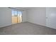 Cozy bedroom with a sliding glass door leading to a patio at 4730 W Northern Ave # 1141, Glendale, AZ 85301
