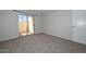 Comfortable bedroom with sliding glass door and neutral tones at 4730 W Northern Ave # 1141, Glendale, AZ 85301
