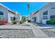 Well-maintained exterior featuring neatly manicured landscaping and a peaceful walkway at 4730 W Northern Ave # 1141, Glendale, AZ 85301