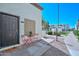 Condo's exterior with a red bistro set and covered porch at 4730 W Northern Ave # 1141, Glendale, AZ 85301