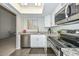 Updated kitchen with granite countertops, stainless steel appliances, and a view into the living room at 4730 W Northern Ave # 1141, Glendale, AZ 85301