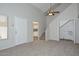 Bright living room features a ceiling fan, stairs, and a view of the kitchen at 4730 W Northern Ave # 1141, Glendale, AZ 85301