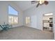 Bright living room with a high ceiling, neutral carpet, and an adjacent kitchen at 4730 W Northern Ave # 1141, Glendale, AZ 85301