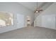 Inviting living room with a ceiling fan, stairs, and an entry door at 4730 W Northern Ave # 1141, Glendale, AZ 85301