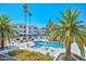 Inviting community pool with palm trees and lounge chairs at 4730 W Northern Ave # 1141, Glendale, AZ 85301