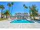 Beautiful community pool with lounge chairs, palm trees, and well-maintained surroundings at 4730 W Northern Ave # 1141, Glendale, AZ 85301