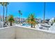 View of community pool surrounded by palm trees, offering a relaxing resort style living at 4730 W Northern Ave # 1141, Glendale, AZ 85301