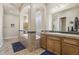 Bathroom boasts double sink vanity, tiled bath surround, and lots of natural light at 5330 S Big Horn Pl, Chandler, AZ 85249