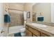 Traditional bathroom with a single sink, bath-tub, and a framed mirror at 5330 S Big Horn Pl, Chandler, AZ 85249