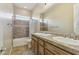 Bathroom features double sinks, framed mirror, shower-tub, and tile floors at 5330 S Big Horn Pl, Chandler, AZ 85249