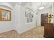 Inviting foyer with tile flooring, decorative niches, and a stylish mirror, creating a warm welcome at 5330 S Big Horn Pl, Chandler, AZ 85249