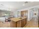 Open kitchen with island featuring granite countertops, stainless steel appliances, and tiled floors at 5330 S Big Horn Pl, Chandler, AZ 85249