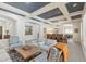 Stylish living room with coffered ceilings open to dining area, ideal for gatherings and relaxation at 5330 S Big Horn Pl, Chandler, AZ 85249
