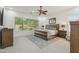 Main bedroom with large window, ceiling fan, rug, and furniture at 5330 S Big Horn Pl, Chandler, AZ 85249