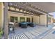 A covered patio with an outdoor seating area and BBQ grill at 5330 S Big Horn Pl, Chandler, AZ 85249