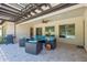 Beautiful covered patio with fan, grill and cozy outdoor seating at 5330 S Big Horn Pl, Chandler, AZ 85249