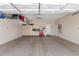 Spacious garage featuring an epoxy floor, storage shelves and cabinets for optimal organization at 5635 W Pecan Rd, Laveen, AZ 85339