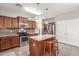 Modern kitchen featuring stainless steel appliances, granite countertops, and a center island at 5635 W Pecan Rd, Laveen, AZ 85339