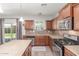 Well-lit kitchen showcasing granite countertops, stainless steel appliances, and ample cabinet space at 5635 W Pecan Rd, Laveen, AZ 85339