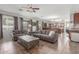 Open-concept living room with a view into the kitchen and dining area at 5635 W Pecan Rd, Laveen, AZ 85339