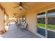 Relaxing covered patio, complete with ceiling fans and comfortable seating, perfect for enjoying the outdoors at 5635 W Pecan Rd, Laveen, AZ 85339