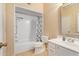 Bright bathroom featuring a shower-tub combo and a white vanity with framed mirror at 5757 W Eugie Ave # 2084, Glendale, AZ 85304