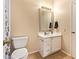 Cozy bathroom featuring a white vanity with drawers and a traditional framed mirror at 5757 W Eugie Ave # 2084, Glendale, AZ 85304