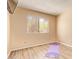 Bright bedroom with wood floors, window, and space for yoga and relaxation at 5757 W Eugie Ave # 2084, Glendale, AZ 85304