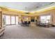 The meeting room features ample seating and fireplace at 5757 W Eugie Ave # 2084, Glendale, AZ 85304