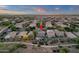 Picturesque aerial of a home with a pool and beautifully landscaped backyard in a serene community setting at 5919 S Banning St, Gilbert, AZ 85298