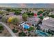 Aerial shot showcasing the property's pool, patio, and landscaping within a well-maintained residential neighborhood at 5919 S Banning St, Gilbert, AZ 85298